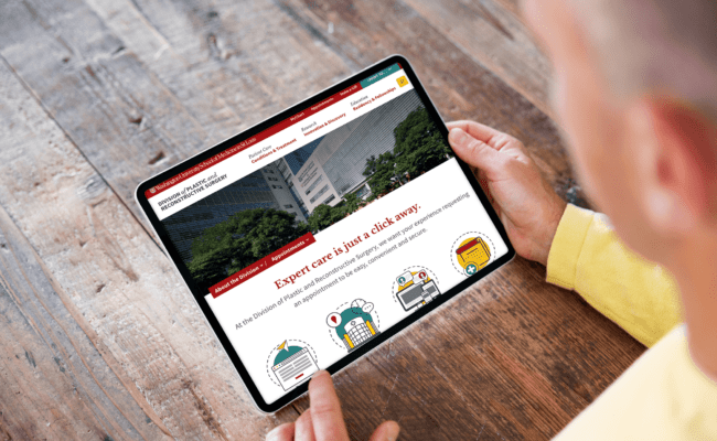 Person viewing a tablet displaying the Appointments page from plasticsurgery.washu.edu.