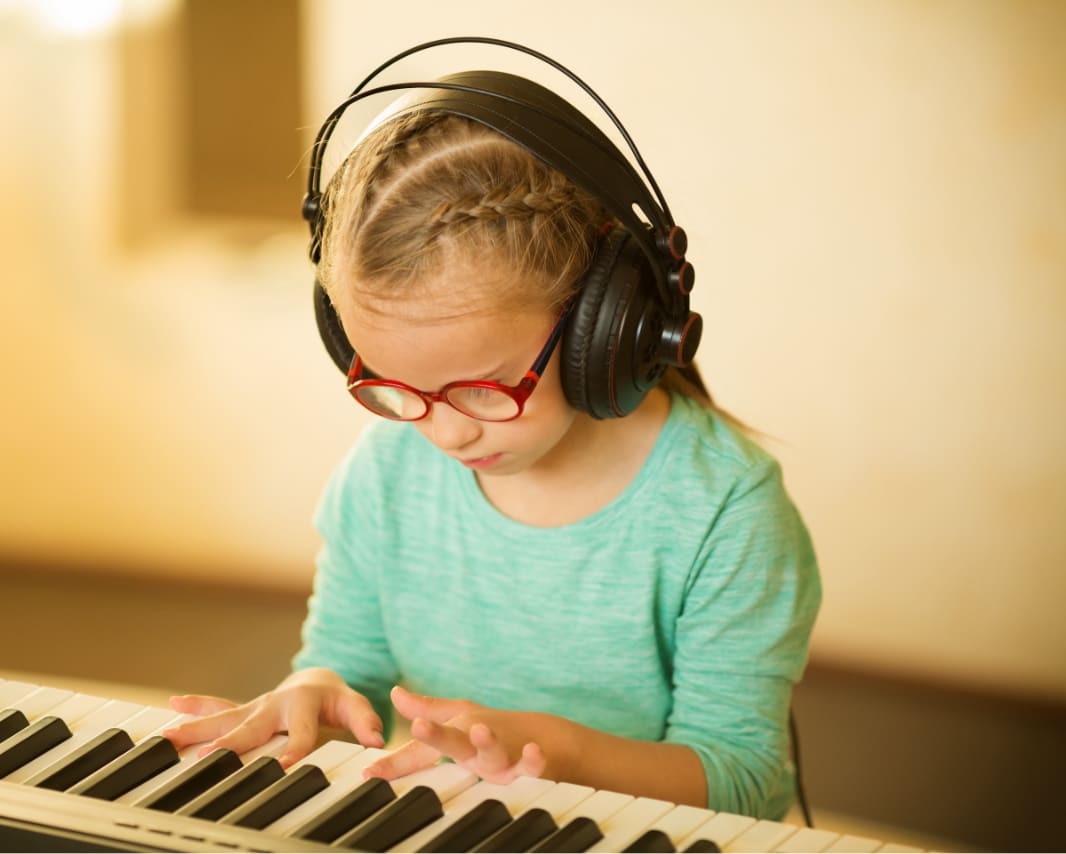 Girl with headphones demonstrating the science of creativity