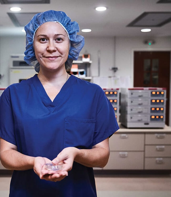 A medical professional in blue scrubs.