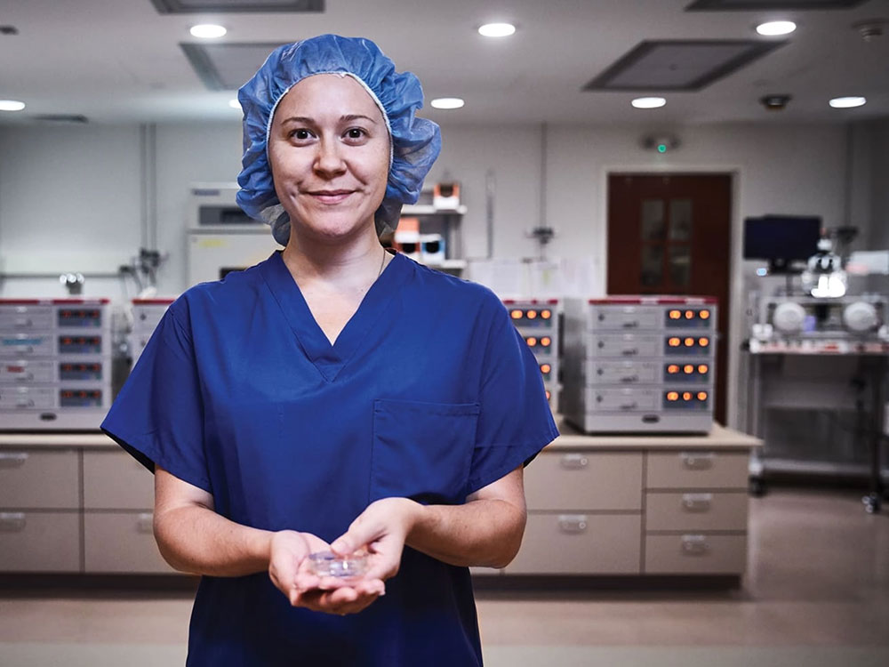 A medical professional in blue scrubs.