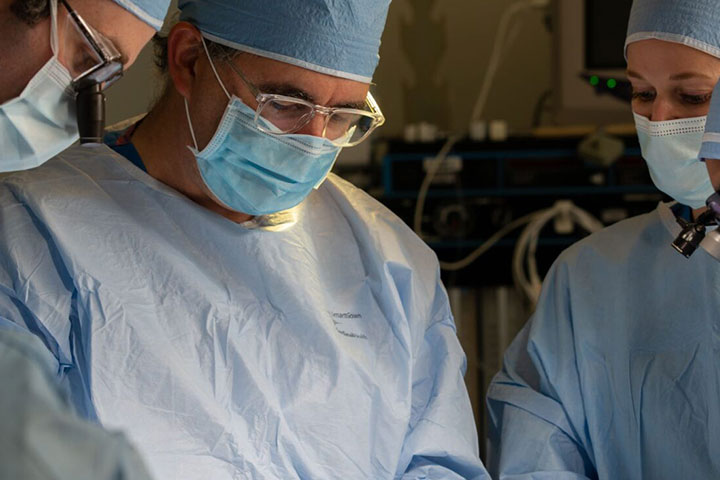 Surgeons performing surgery.